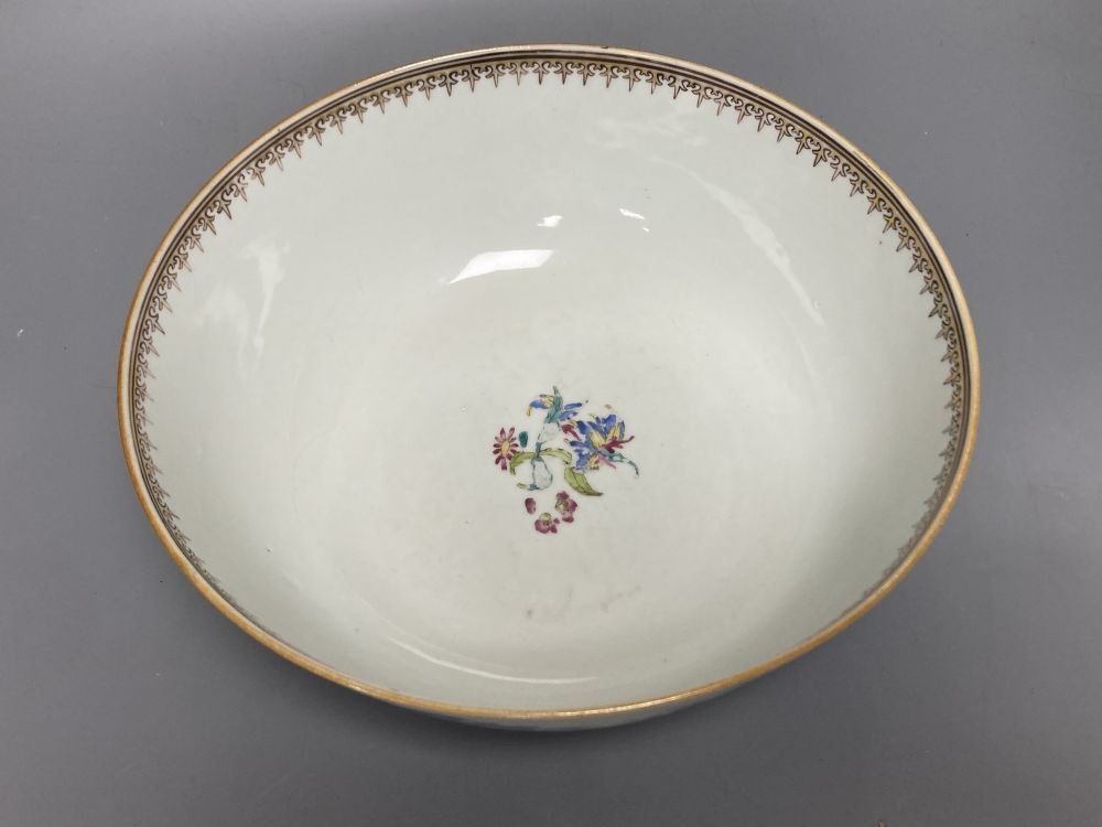A Chinese famille rose punch bowl, Qianlong period, enamel painted in underglaze blue with famille rose enamels, figures in pavilions,